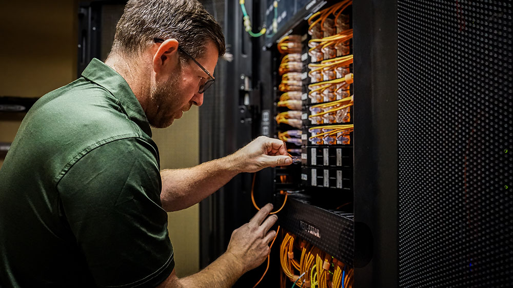 Mark Faust working on a server
